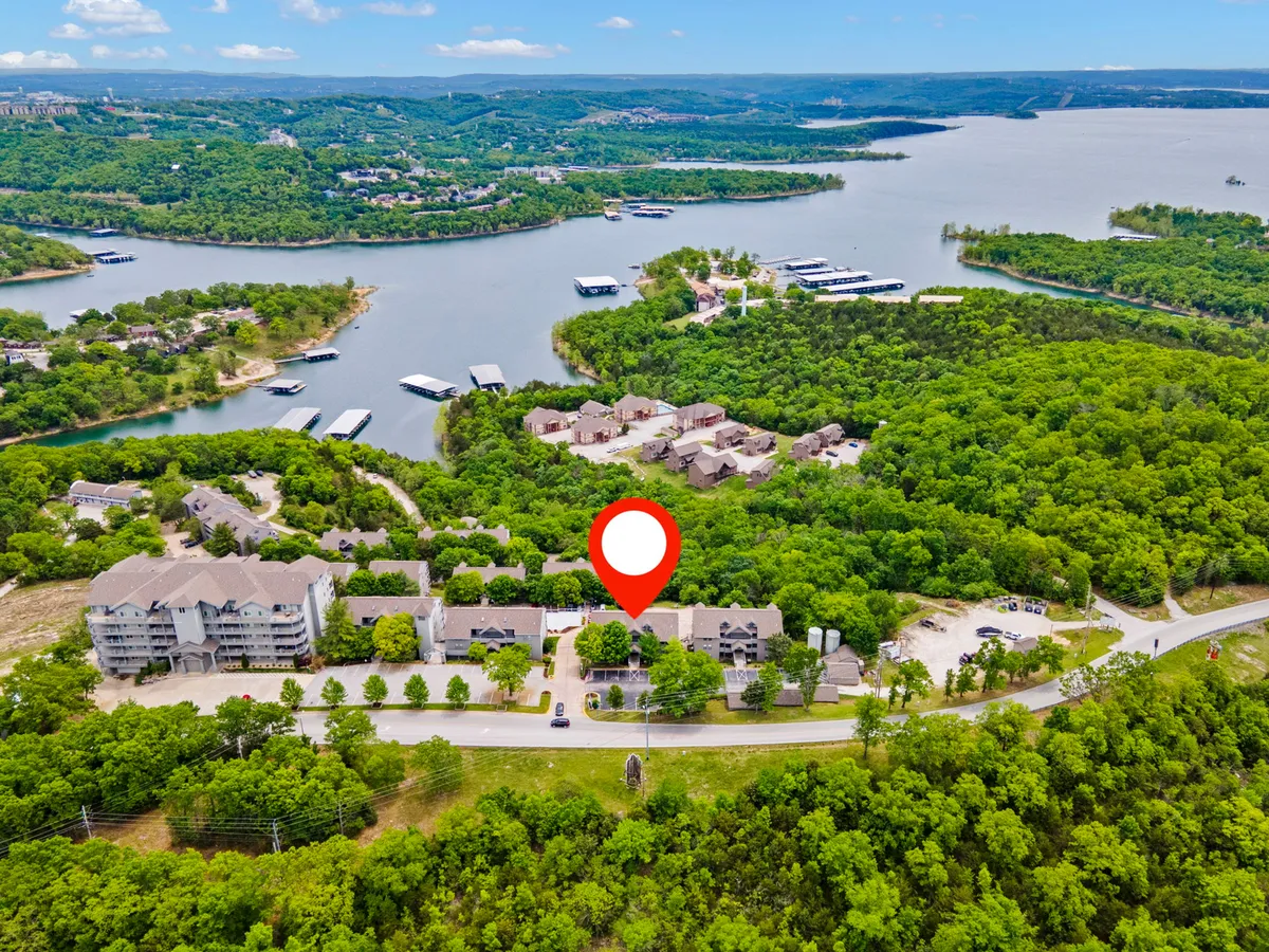 Showcasing lush greenery and serene water bodies with nearby residential buildings, this image evokes a tranquil lakeside setting. Activities like boating, hiking, and picnicking are suggested, offering a sense of nature and outdoor adventure close to the property.